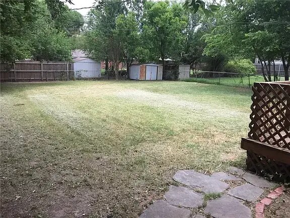 Backyard view from the oversized deck - 209 W Haddock St