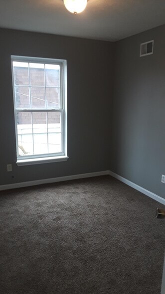Bedroom #3 with new paint and carpet - 1216 Lipps Ln
