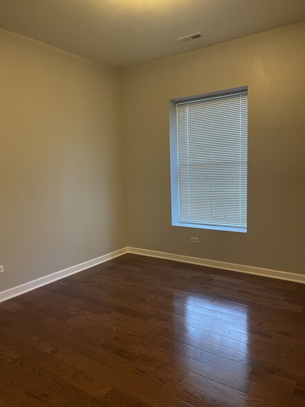 Large Bedrooms with upgraded wood flooring - 6201 S Champlain Ave