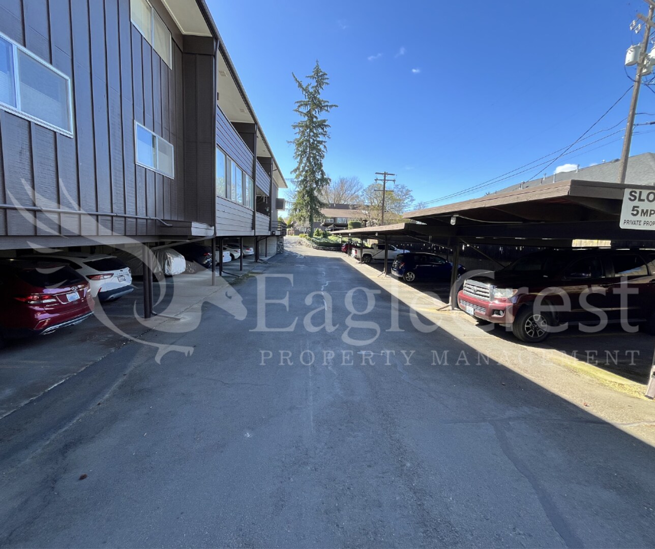 Building Photo - Convenient 2 Bedroom 2 Bathroom Condo Living "In The Trees" with On-Site Amenities