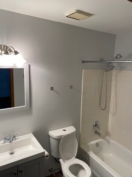 Updated bathroom with a detachable shower head. - 7048 Beulah Ave