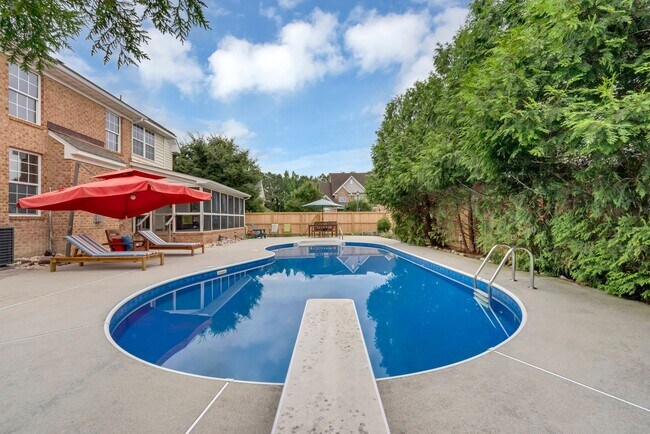 Building Photo - Beautiful brick home with a saltwater pool