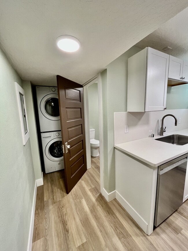 Hall to bath and laundry. Refurbished original door. - 1401 W 13th Ave