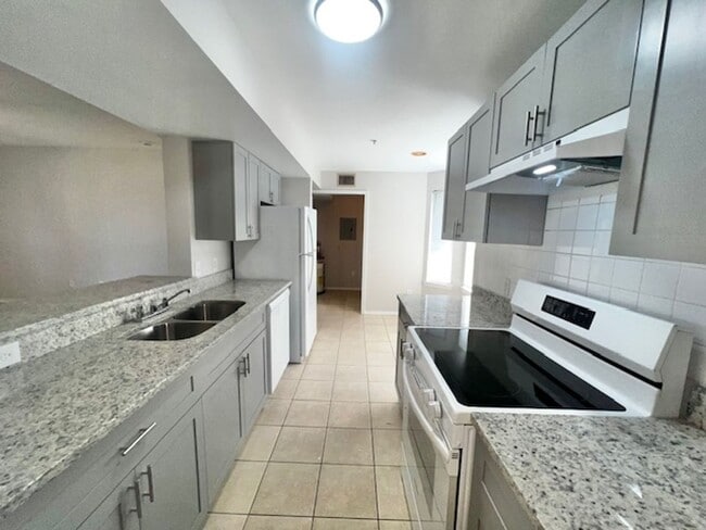 Building Photo - NEW-Remodeled bathroom & kitchen! NEW VINYL PLANK flooring & fresh paint! 2 bedroom 1 bath condo ...