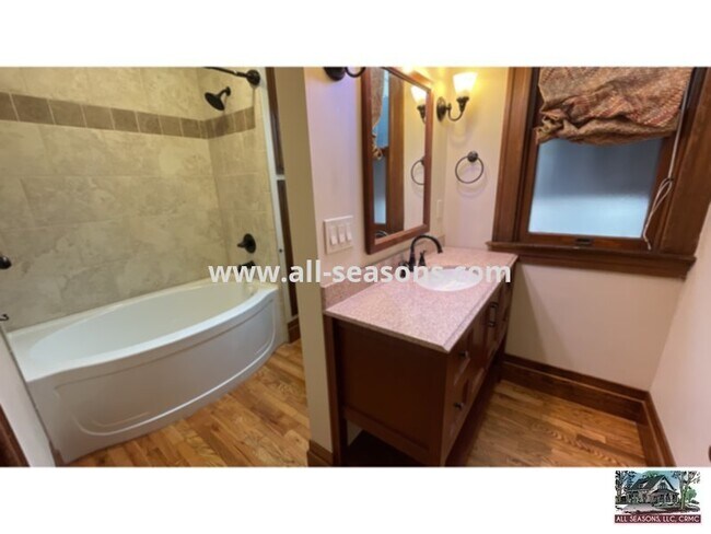 Building Photo - This adorable and spacious main level triplex unit is centrally located and a quick drive or bike ri