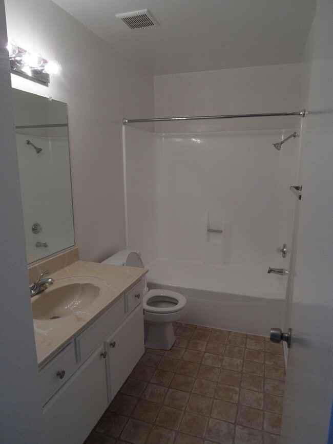 Building Photo - Two Story 4 BR 2.5 BA Condo With 2 Car Garage