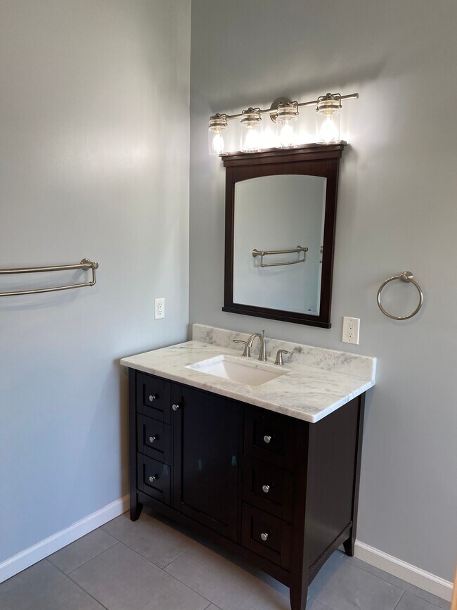 Master bath with furniture vanity piece - 709 Warmstone Ct
