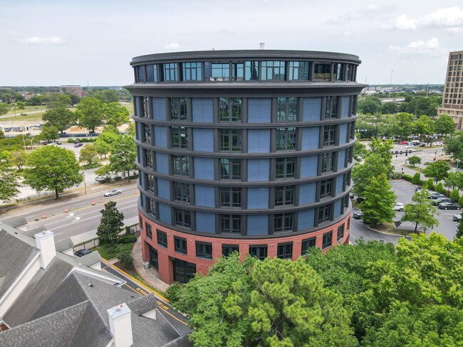 Building Photo - Industrial-Themed Mid-Rise, One-Level Cond...