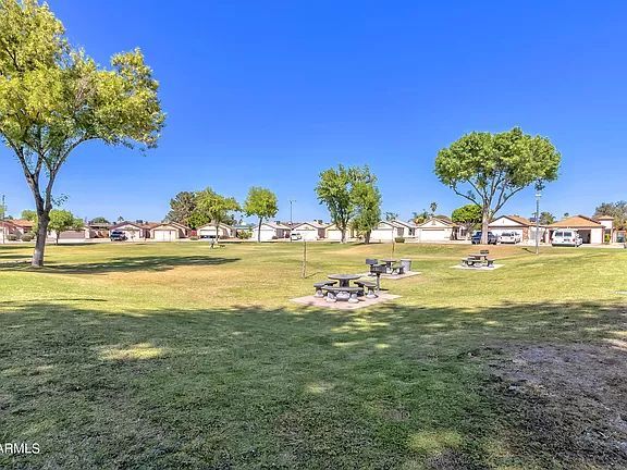 Community tables and BBQs near pool - 18814 N 33rd Dr