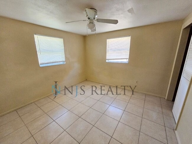 Building Photo - JUST REDUCED!!! True 2/1.5/1 with FIREPLACE, fenced yard and all tile flooring throughout!