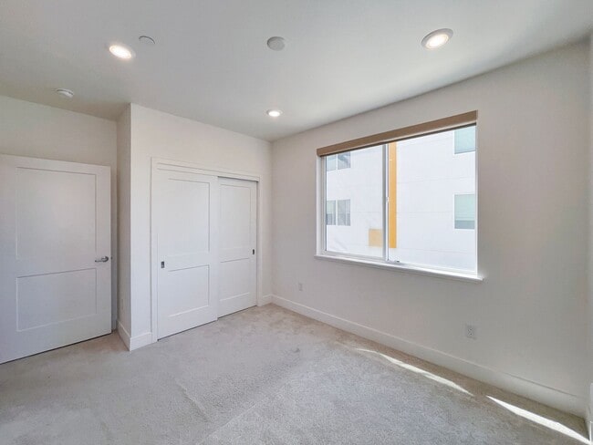 Building Photo - Modern 2BD Fremont Condo – EV Charger, Balcony, & Walk to BART