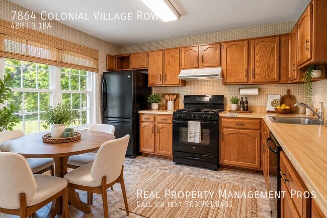 Building Photo - 7864 Colonial Village Row
