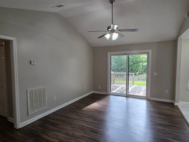 Building Photo - Woodbury Subdivision. 3 bedrooms. 2 baths. Two car garage. Family with vaulted ceiling. Separate ...