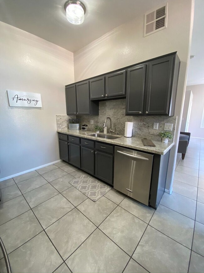 Building Photo - BEAUTIFUL CONDO IN A GATED COMMUNITY FEATURING PLANTATION SHUTTERS, TILE FLOORING AND NEW PAINT T...