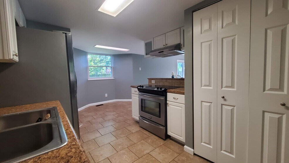 Pantry doors and stove/oven. - 313 Britanna Dr