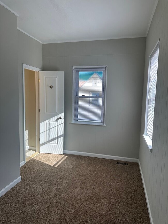 Building Photo - Spacious Renovated Home! Den Space & Bonus Recreation Room in Basement! Central Air! W/D! 2 Car G...