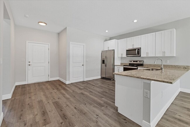 Building Photo - Brand new Duplex stocked with upgrades