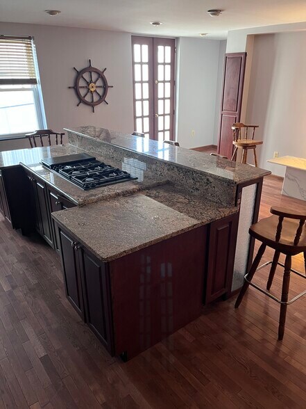 Kitchen Island with Gas Cooktop & Exhaust Fan - 409 S Spring St