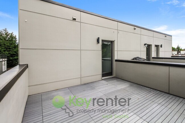Building Photo - Modern 3 Bedroom with Rooftop Deck and In Unit Laundry