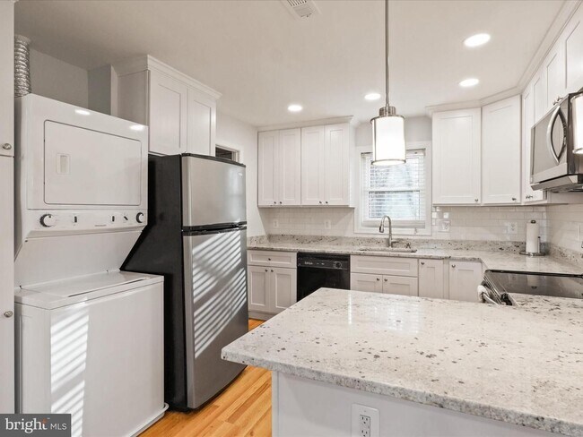 Building Photo - This home blends urban accessibility with peaceful natural surroundings.