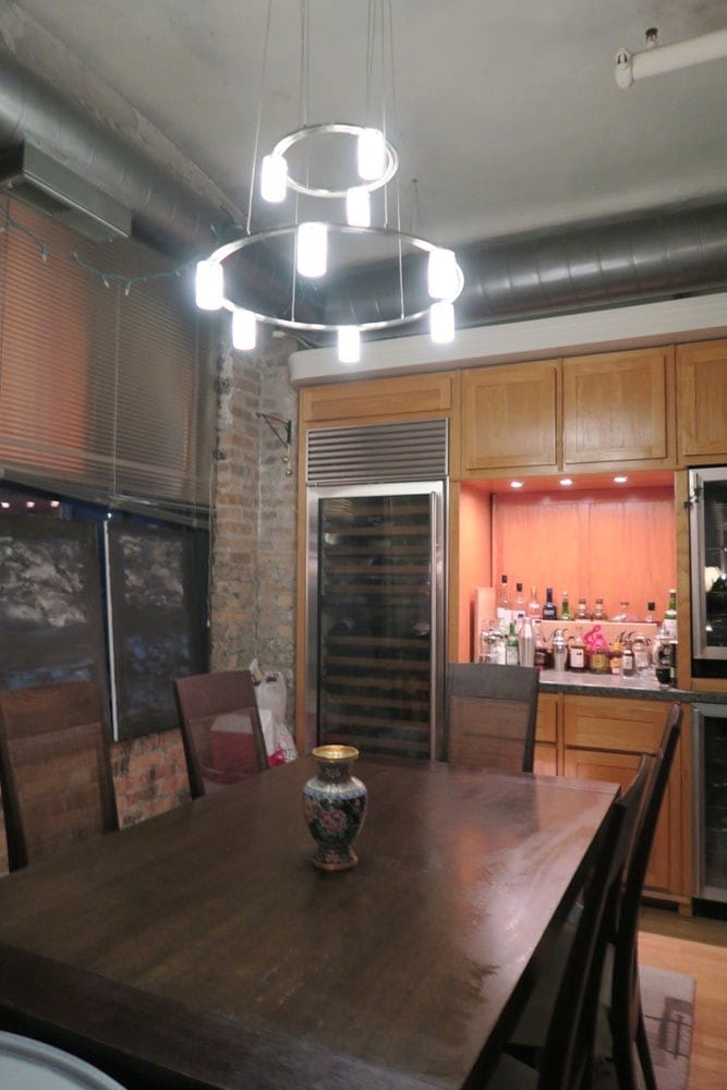 Dining room with modern chandelier - 801 S Wells St