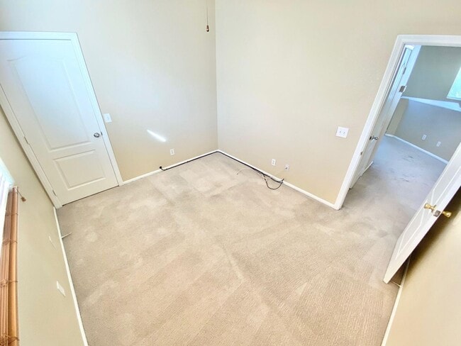 Building Photo - THIS SPACIOUS RESIDENCE FEATURES 4 BEDROOM...