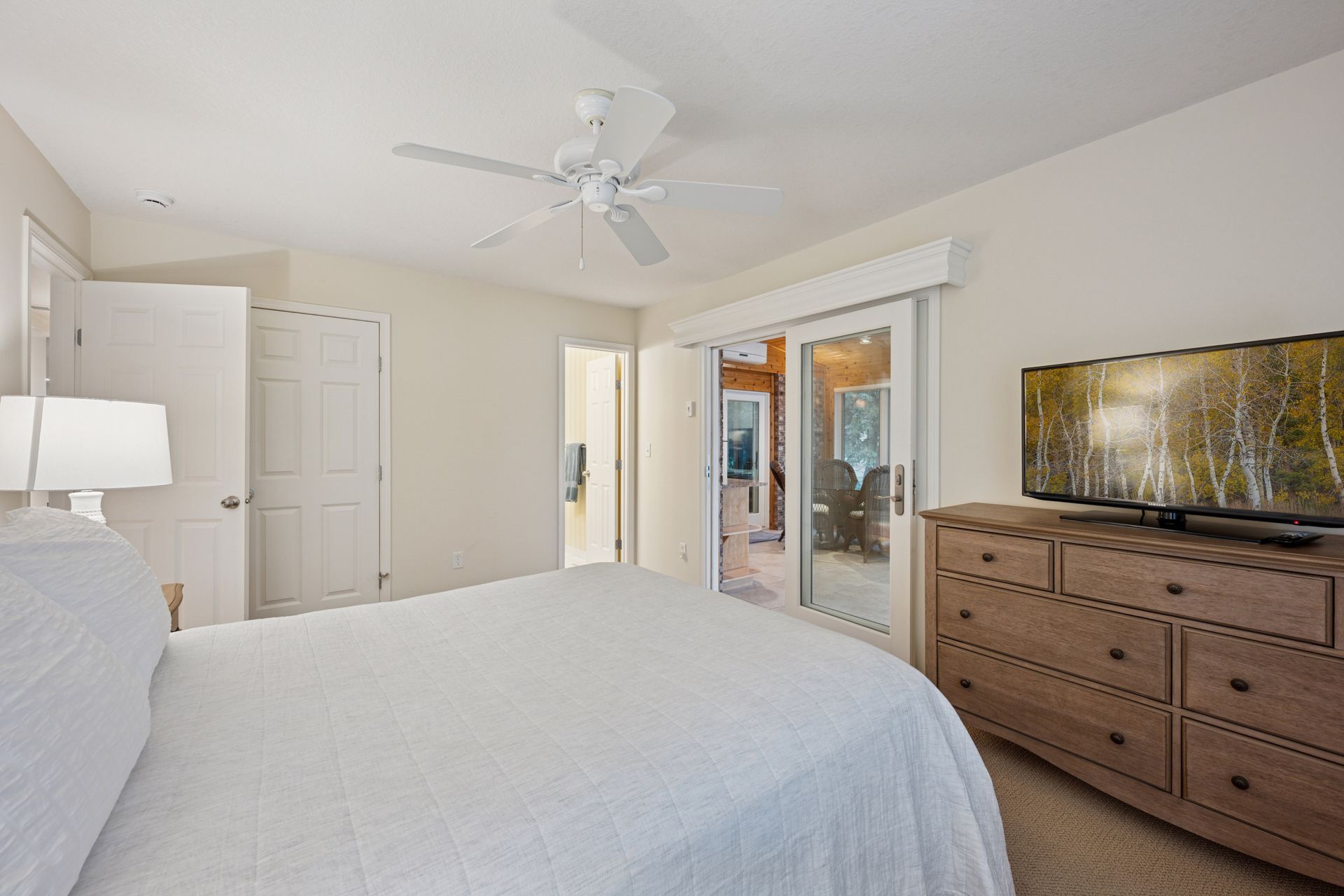 Primary bedroom with access to the sun room - 145 Holly Ln N