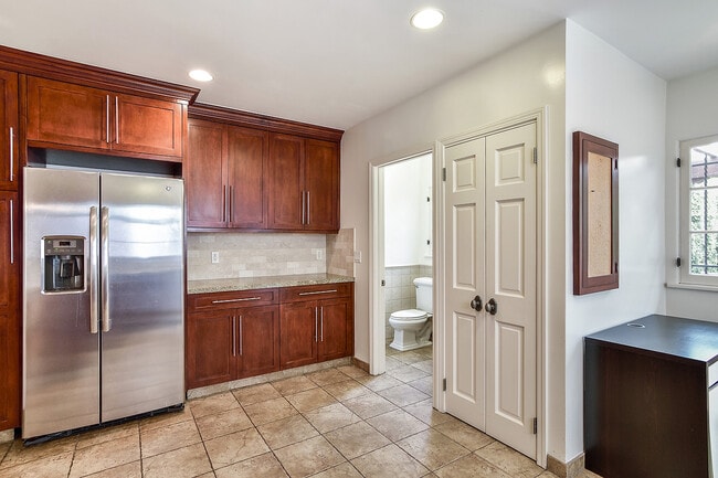 Kitchen with 1st floor powder room - 8459 W 4th St
