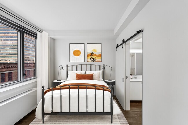 Bedroom with hard surface flooring - AVA High Line