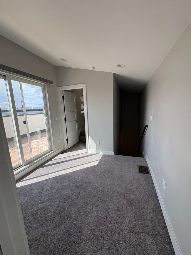 Building Photo - Modern 2 Bed + Flex Townhome with Rooftop Deck Near Paco Sanchez Park & Light Rail