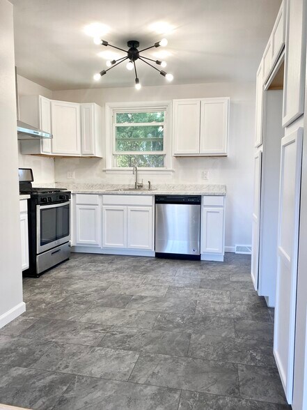Kitchen includes oven, dishwasher, and fridge - 2136 W 22nd St