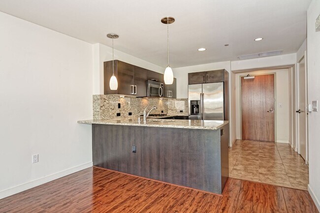 Building Photo - Modern Downtown Condo in Premier High-Rise...