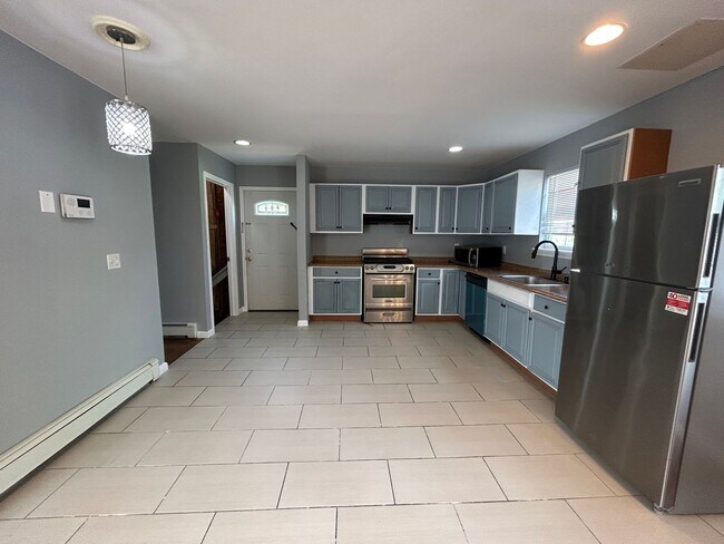 Building Photo - Discover Your Dream Home in Neptune: Spacious 4-Bedroom, 2.5-Bath with Private Backyard and Drive...