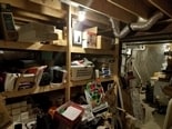The unfinished side of the basement includes TONS of storage space and lots of built in shelving. - 1809 Stark Drive