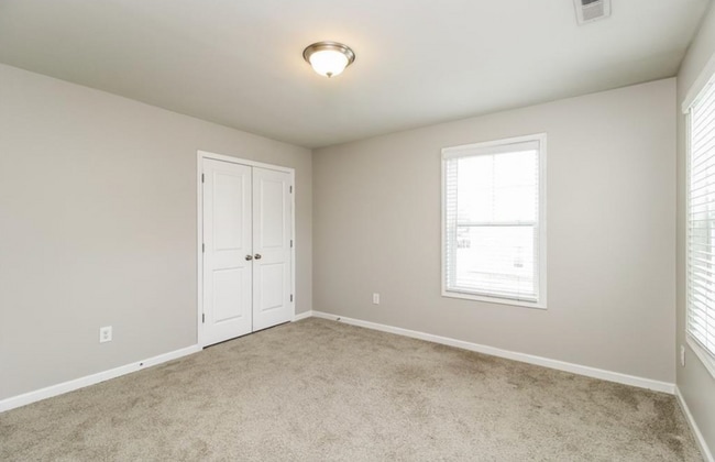 Building Photo - Impeccable maintenance-free 2 level 4 bedroom and 2.5 bath townhome in Greensboro