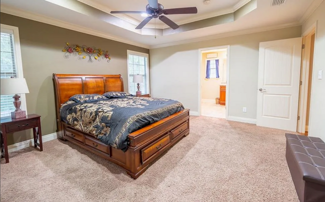 The Main Bedroom No. 4 - approx. 14 x 14. Windows face East. En Suite Bathroom in the background. - 12366 Copperwood Dr