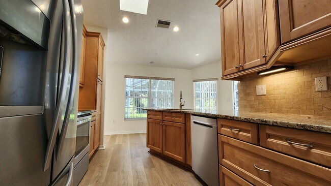 Building Photo - Fresh Paint, New Floors, and a Heated Pool...