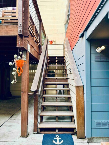 Stairs up from the gated patio to the sun deck - 328 Harriet St