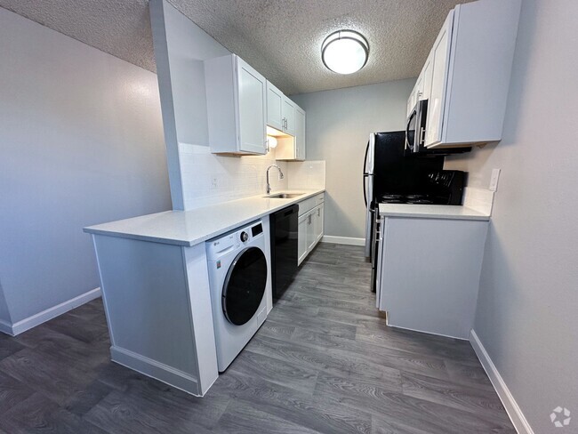 Kitchen with Washer/Dryer combo - Reserve at Water Tower Village