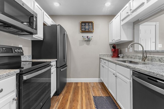 Building Photo - Welcome to Coastal Living at Harbor Landing Condominiums!