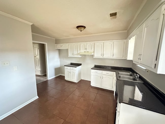 Building Photo - MOVE-IN READY! 3BR/2BA in Quiet Cove | Brick Fireplace | Fenced Yard & Patio!