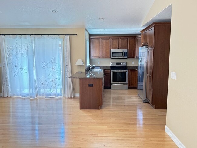 Building Photo - 4 BEDROOM, 3 BATHROOM TWINHOME WITH 2 CAR ATTACHED GARAGE IN NORTH CHEYENNE