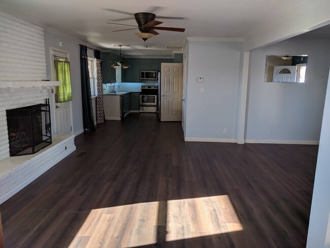 Open floor plan, view into the dining room and kitchen - 8716 E 47th Pl