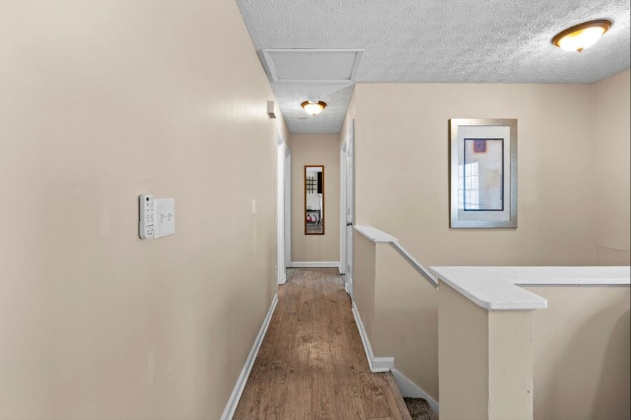 Hallway to bedrooms/bathroom - 5300 Forest Downs Ln