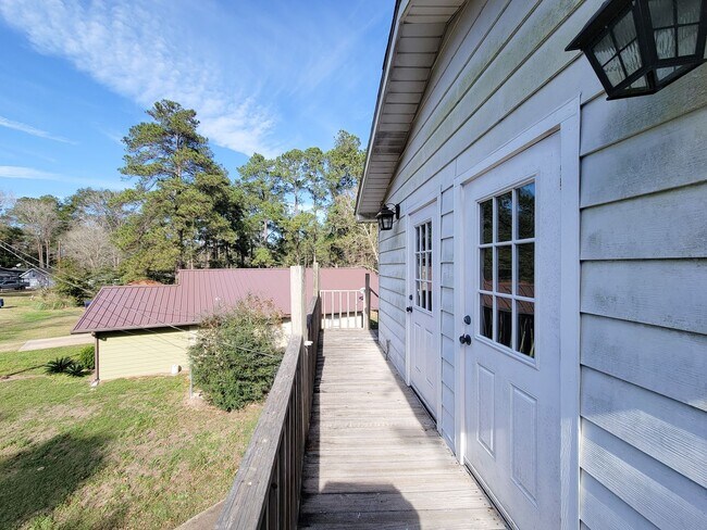 Building Photo - Escape to your updated 3-bed, 2-bath oasis in Goodrich, TX, featuring modern finishes, an open la...