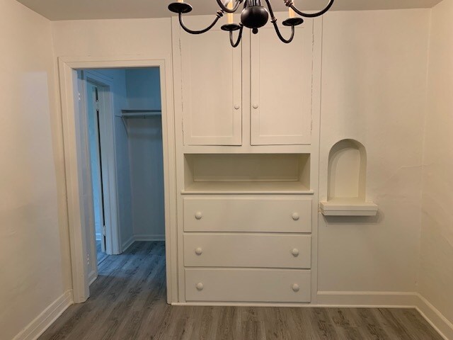 View of the door from the dining room into a storage space and then into the second smaller bedroom. - 24606 University Ave