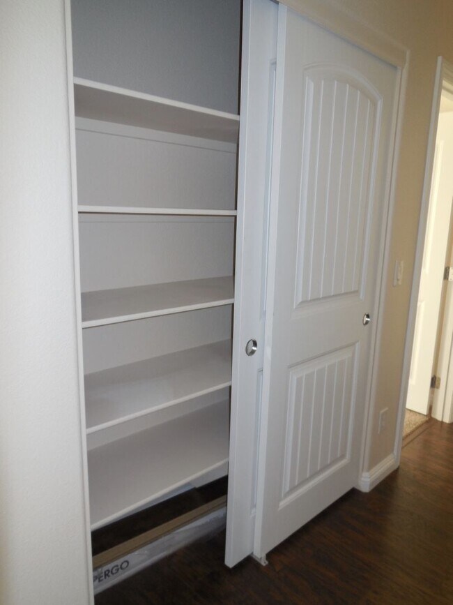 Building Photo - Spacious House w/Tons of Storage,Tile & Wo...