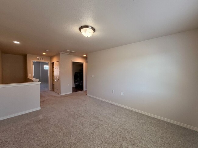 Building Photo - Move-In Ready 3-Story Townhome with Loft & 2-Car Garage