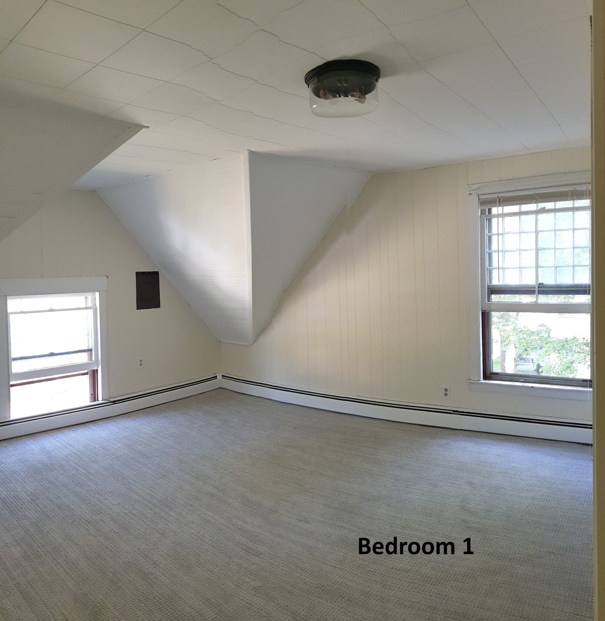 - Bright and spacious with charming architectural angles, this bedroom offers comfort and character - 412 Morris Ave