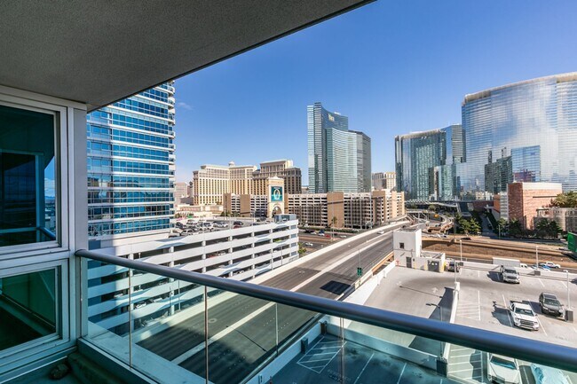 Building Photo - Iconic Strip-View Luxury | Elegant 1BR + Den High-Rise Residence